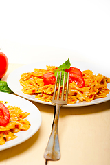 Image showing Italian pasta farfalle butterfly bow-tie and tomato sauce