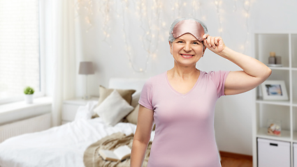 Image showing senior woman in pajamas and eye sleeping mask