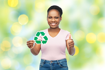 Image showing african american woman holding recycling sign