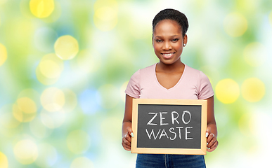 Image showing happy woman holds chalkboard with zero waste words