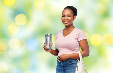 Image showing woman with tumbler and food in string bag