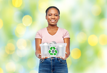 Image showing african american woman sorting metallic waste