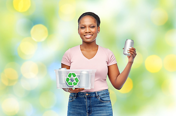 Image showing african american woman sorting metallic waste