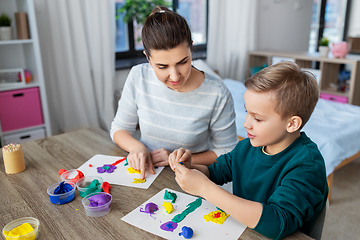 Image showing mother and son playing with modeling clay at home