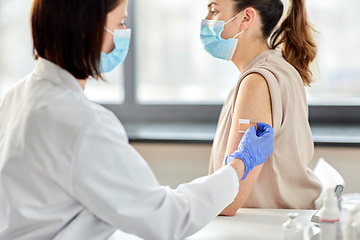 Image showing close up of doctor attaching patch to patient