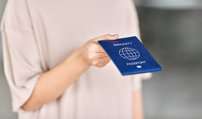 Image showing close up of woman holding immunity passport