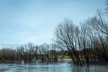 Image showing Flood waters engulf large areas included  this road