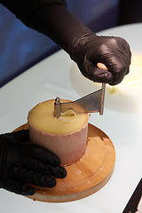 Image showing Special cheese knives. The girolle scraper. Making cheese shavin
