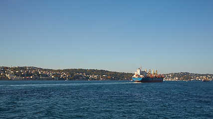 Image showing Logistics and transportation of International Container Cargo ship in the ocean at twilight sky, Freight Transportation, Shipping