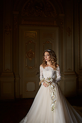 Image showing Beautiful bride with bouquet in luxury interior in the Baroque style.