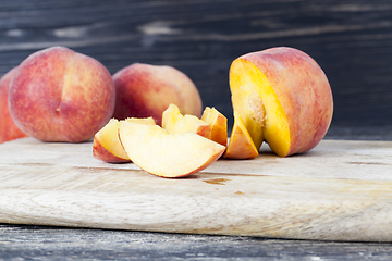 Image showing cut into pieces ripe peach
