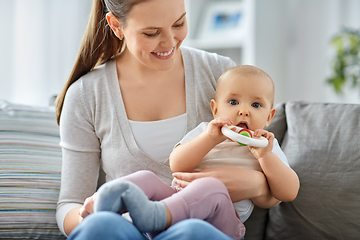 Image showing mother and little baby with teething toy at home