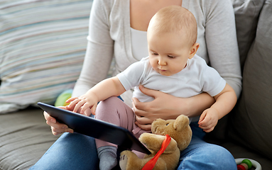 Image showing mother and baby girl with tablet pc at home