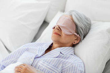 Image showing senior woman with eye mask sleeping in bed at home