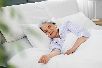 Image showing senior woman sleeping in bed at home bedroom