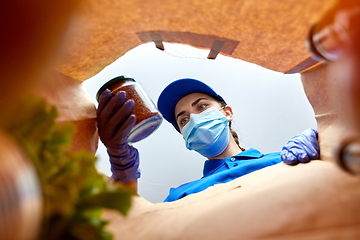 Image showing delivery girl in gloves and mask with food in bag