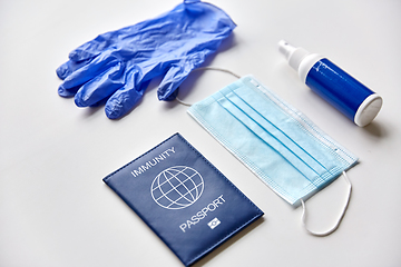 Image showing immunity passport, mask, gloves and hand sanitizer