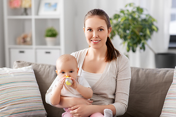 Image showing close up of mother with baby drinking water