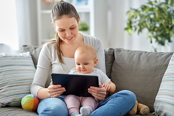 Image showing happy mother and baby girl with tablet pc at home