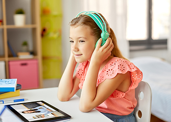 Image showing girl with tablet pc having online class at home