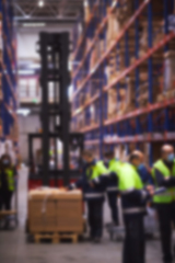 Image showing Blur warehouse background. Warehouse worker taking package in the shelf in a large warehouse in a large warehouse