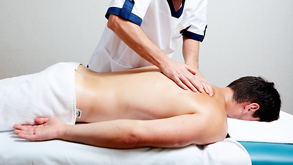 Image showing a massage therapist makes a man massage spa treatment health