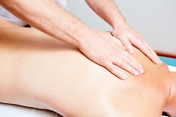 Image showing a massage therapist makes a man massage spa treatment health