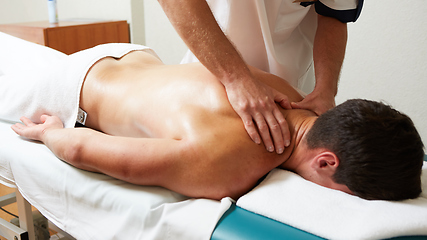 Image showing a massage therapist makes a man massage spa treatment health