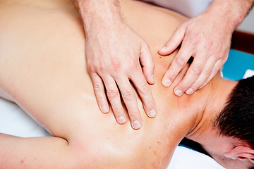 Image showing a massage therapist makes a man massage spa treatment health