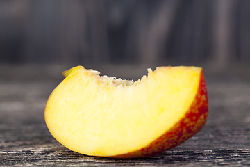 Image showing one fresh slice of ripe peach