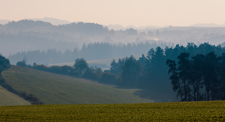 Image showing Autumn foggy and misty sunrise landscape