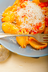 Image showing Italian snail lumaconi pasta with tomatoes