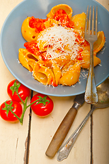 Image showing Italian snail lumaconi pasta with tomatoes