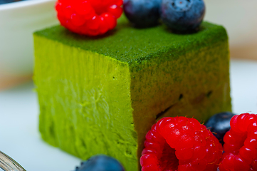 Image showing green tea matcha mousse cake with berries