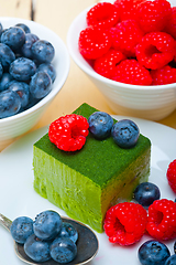 Image showing green tea matcha mousse cake with berries