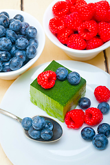 Image showing green tea matcha mousse cake with berries