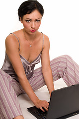 Image showing Woman in pajamas on laptop