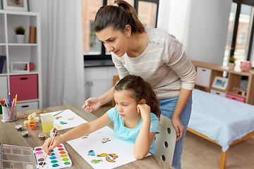 Image showing mother with little daughter drawing at home