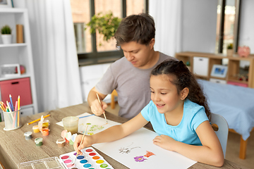 Image showing happy father with little daughter drawing at home