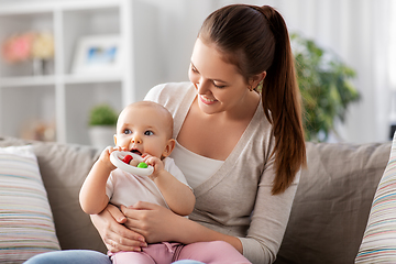 Image showing mother and little baby with teething toy at home