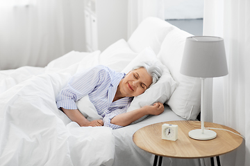 Image showing senior woman sleeping in bed at home bedroom