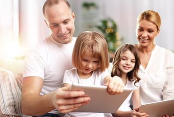 Image showing happy family with tablet pc computers at home