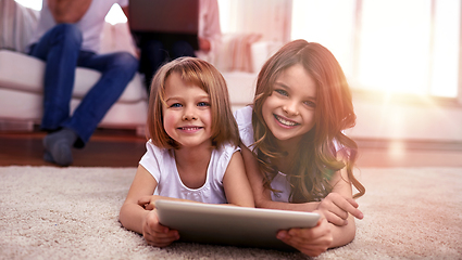 Image showing happy little girls with tablet pc computer at home