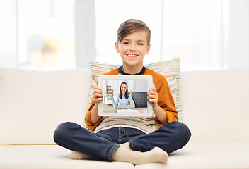 Image showing happy boy with teacher on tablet computer at home