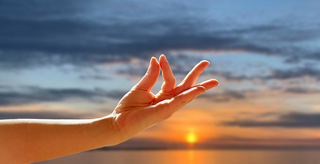 Image showing hand of meditating yogi woman showing gyan mudra