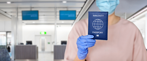 Image showing close up of woman holding immunity passport