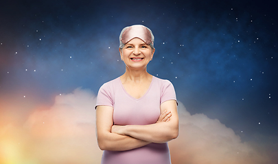 Image showing senior woman in pajamas and eye sleeping mask