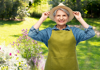 Image showing portrait of smiling senior woman in garden apron