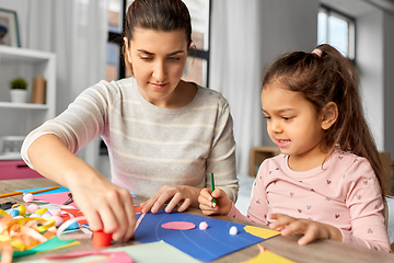 Image showing daughter with mother making applique at home