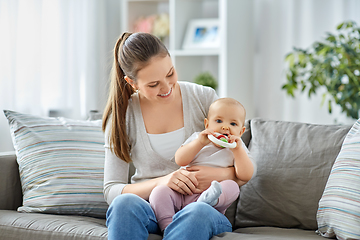 Image showing mother and little baby with teething toy at home